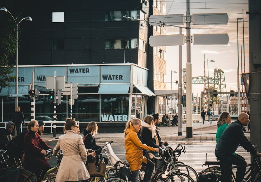 men and women riding on bikes on road